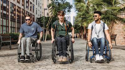 Manual wheelchair Kueschall K-Series young men on street