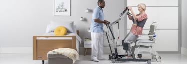 The Invacare ISA standard stand assist lifter, patient and carer in bed transfer