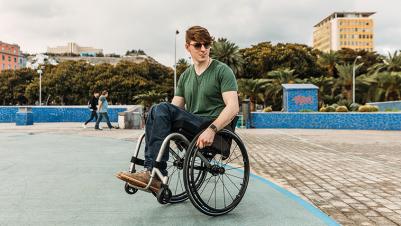 Manual wheelchair Kueschall K-Series young man outside